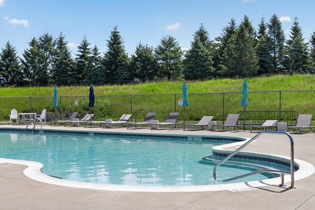Relax by the sparkling pool at Lake Shore Park Apartments, where lush greenery creates a tranquil escape. Enjoy sun-soaked days and refreshing swims—your oasis awaits. Schedule a visit today!