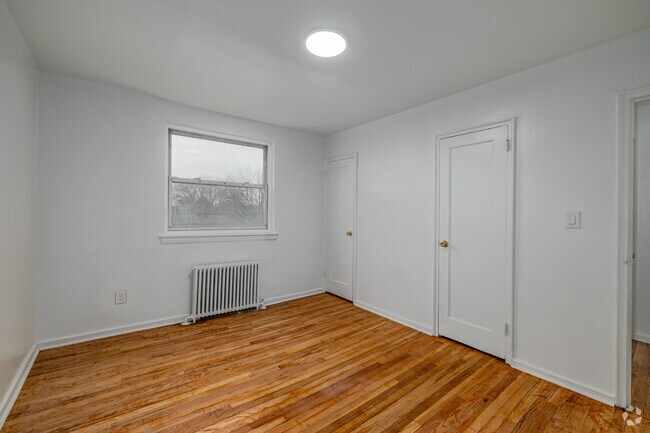 2BR, 1BA - 771SF - Primary Bedroom - Elmwood Terrace Apartments