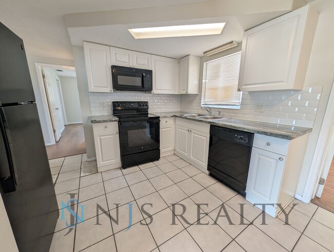 Photo - 3 bed,2 bath ~ With garage, workshop & shed!! NEW floors, NEW paint! Updated bathroom & kitchen w...