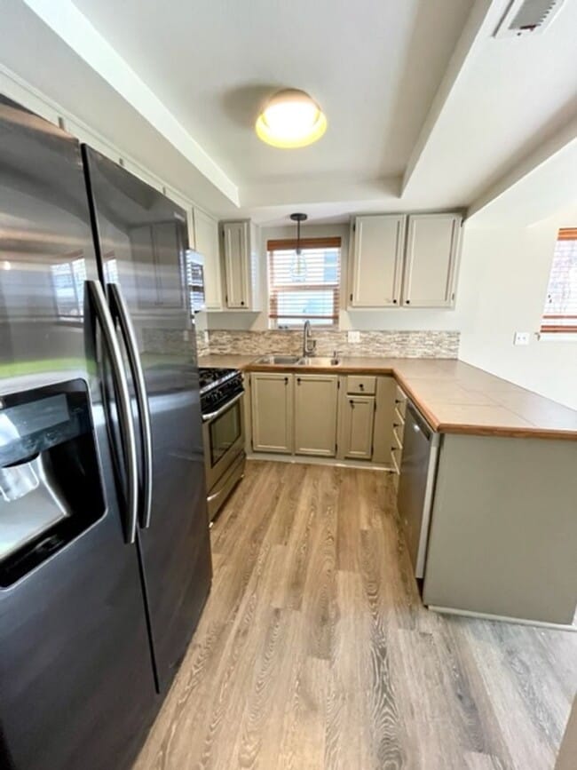 Photo - Water/Sewer/Garbage and landscaping included! A/C too! Unit 11