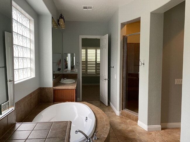 Photo - 5-Bed Retreat with Granite Elegance & Cozy Fireplace – 3690 Sq Ft of Comfort in Las Vegas with a ...