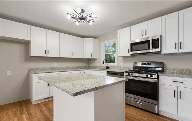 Photo - Modern 4 Bedroom Home with Granite Kitchen & Tiled Baths