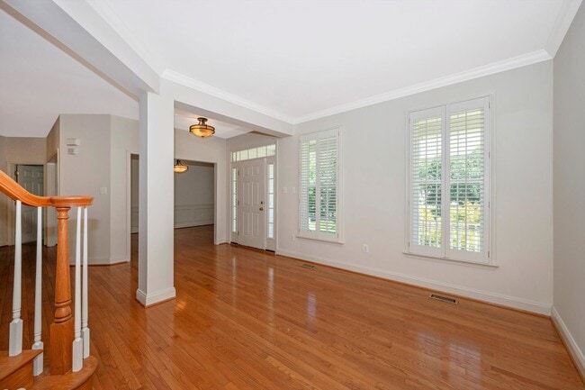 Photo - Main Level Primary Suite & Soaring Two Story Family Room