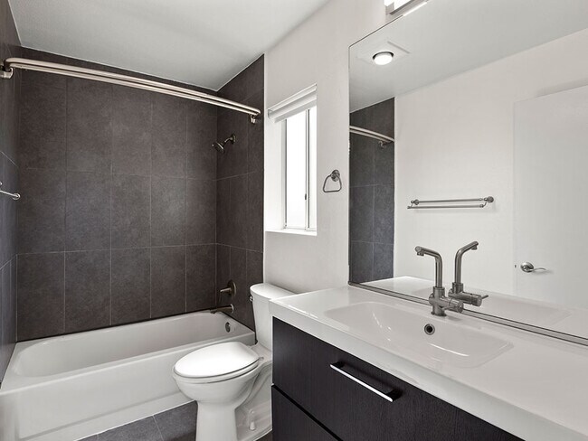 Modern styled bathroom with tub and shower.