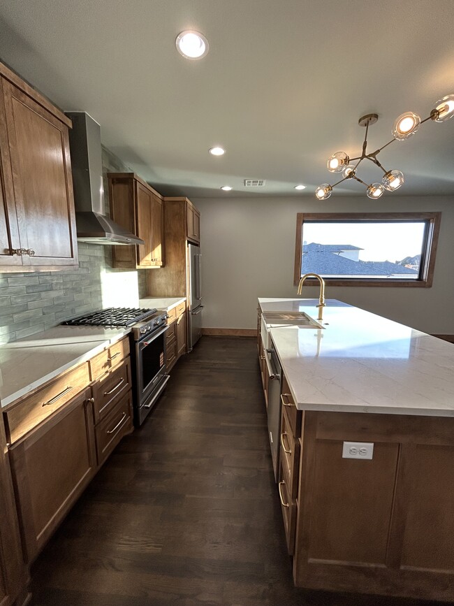 Well-appointed kitchen with KitchenAid range, oven, dishwasher and refrigerator - 20980 Cortona Dr