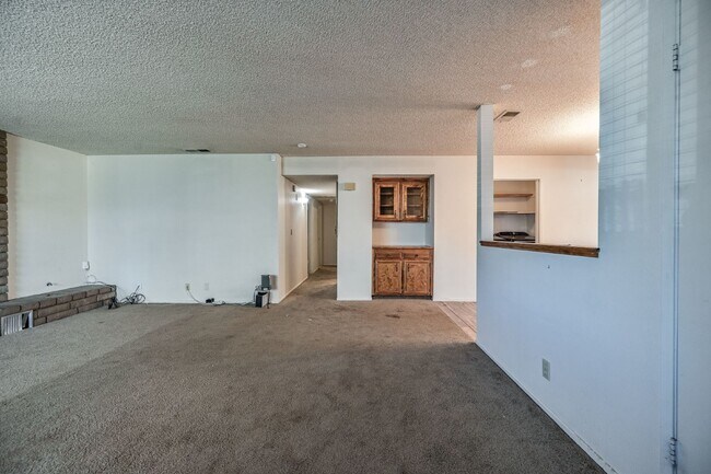 3 bedroom, 2 bath with large living room and brick fireplace.  Good size kitchen with tons of cab...