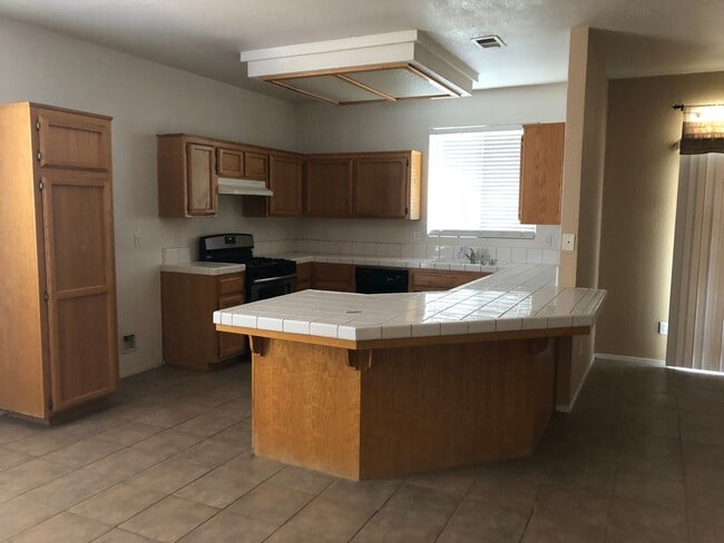 Photo - Coming Soon: Spacious 3 Bedroom, 2 Bath Tevis Ranch Home with Fireplace, Covered Patio & 2-Car Ga...