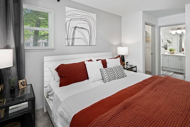 Walk-in closet and large windows in main bedroom