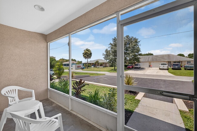 Screened-In Lanai - the perfect spot to enjoy a cup of coffee