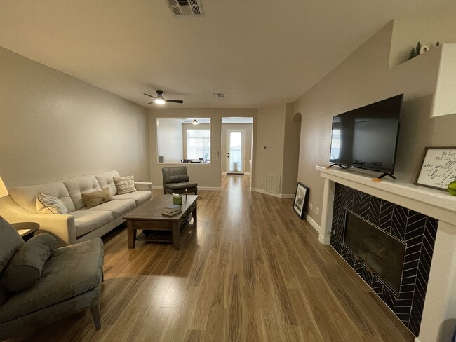 Living room w/ gas fireplace. - 12484 Heatherton Ct Condo Unit 54