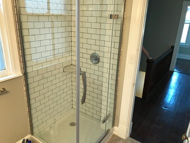 Tile shower with glass enclosure. - 2221 Oakland Ave