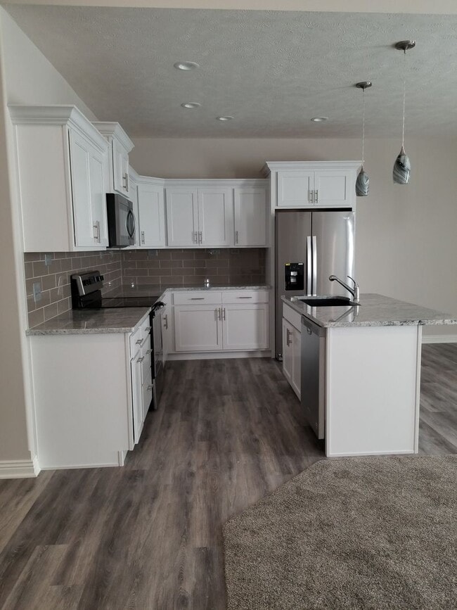 Photo - Daylight ranch townhome with 2 stall garage.  Private driveway and covered deck. high end finishe...