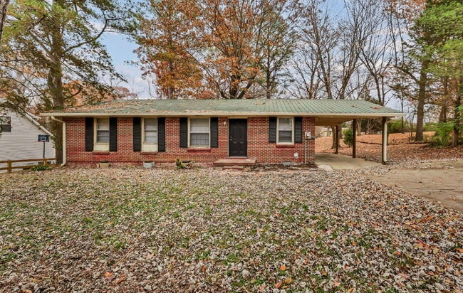 Photo - Cozy 3BR Home with Spacious Yard & XL Carport!