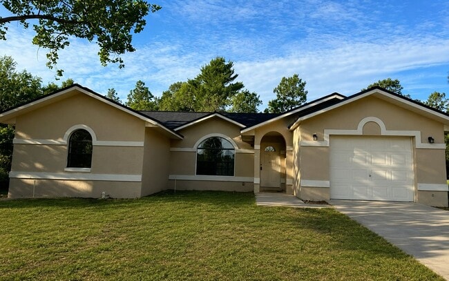 Building Photo - Beautiful 4- Bedroom Home with Arched Windows, Open Floor Plan & One-Car Garage in Silver Springs...