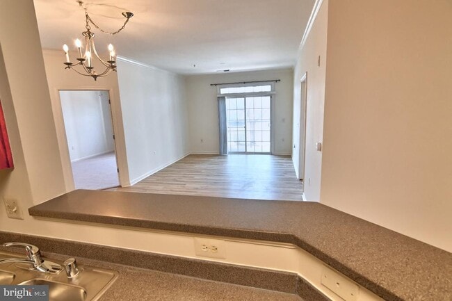 Building Photo - 21216 McFadden Square Unit 108