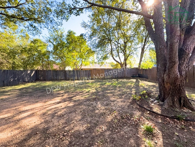 Photo - Cozy 3-Bedroom Home with Fireplace, Covered Patio & Large Fenced Backyard for Lease