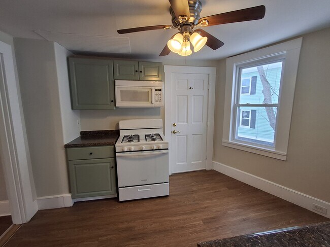 The door in this photo leads to the back stairs. - 13 Mulberry St Unit #2