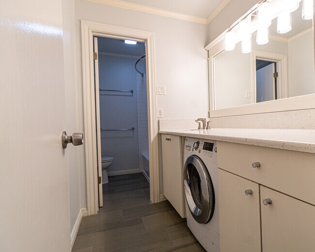 Renovated bathroom with luxurious tile an granite countertop. Bathtub newly refinished. - 300 Crockett St Unit Apt 214
