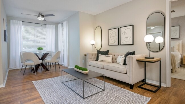 Bright and airy living room with a versatile bonus space, inviting you to create a cozy oasis for your hobbies, passions, or relaxation. - Beachway Links