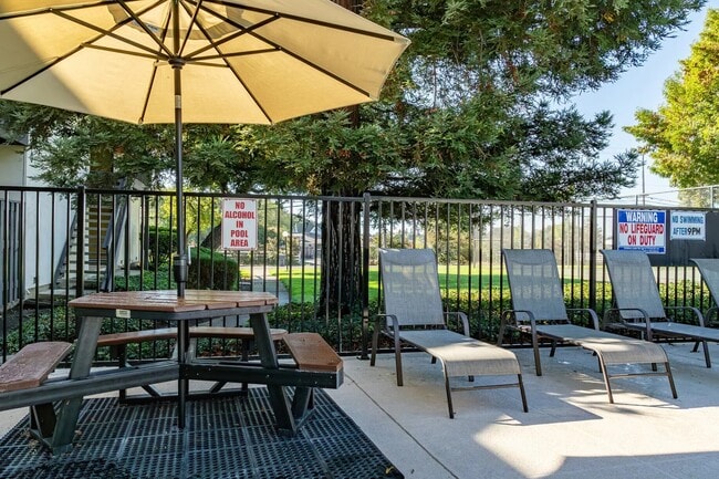 Pool sitting area - Country Club Apartments