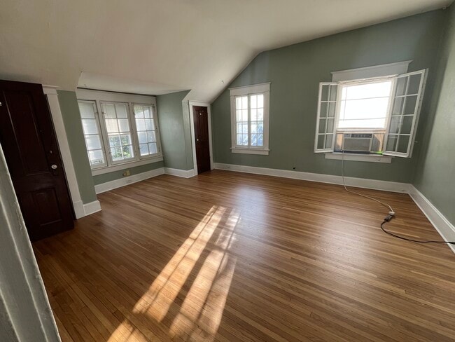 The family room has beautiful hardwood floors and lots of natural light.