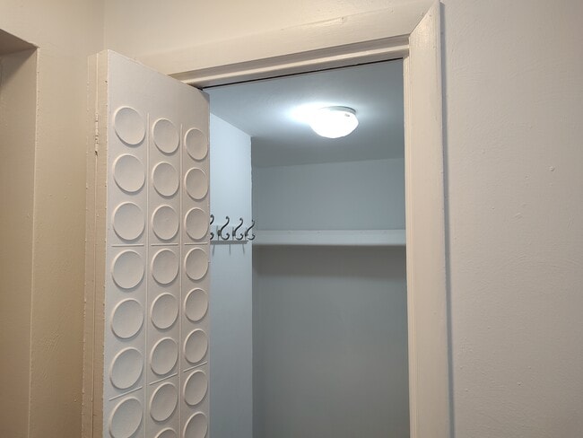 Walk-in coa/storage closet at entrance