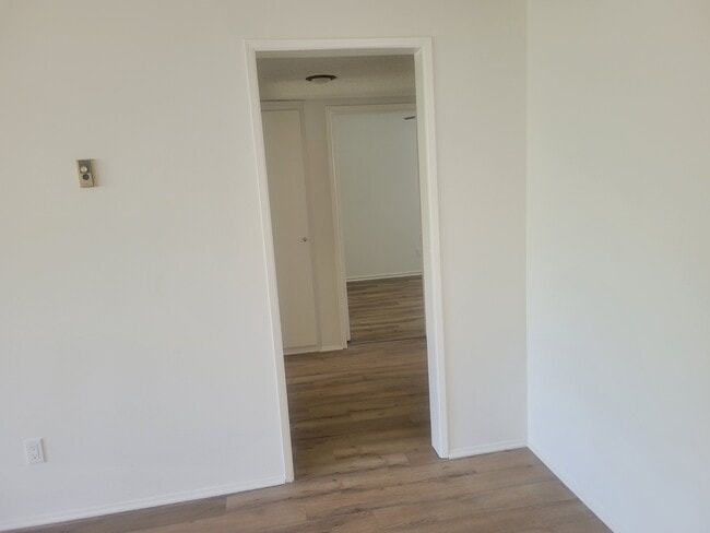 Hallway to bedrooms and tub bath - 21030 Ladeene Ave Unit B