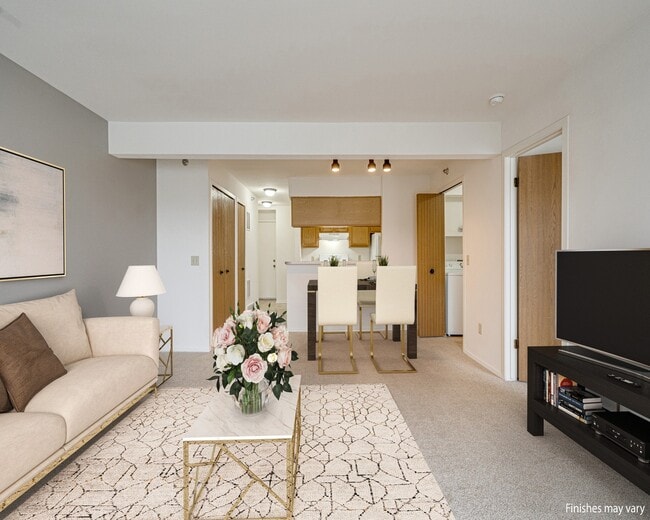 Azalea Layout Model Living Room with Kitchen View - Portsmouth Apartments