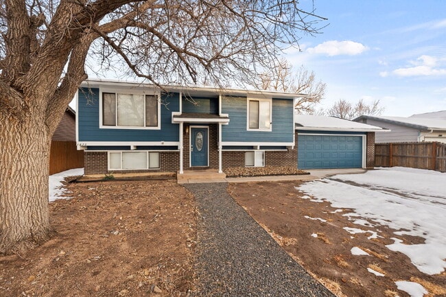 Photo - Spacious Split-Level Home with Finished Basement, Deck, Fenced Yard & 2-Car Garage