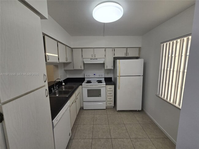Building Photo - 8750 Royal Palm Blvd Unit 109-3