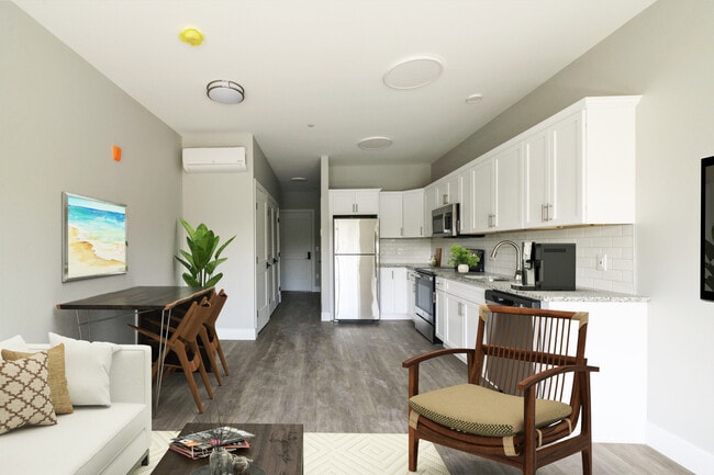 Virtually staged studio - view from living space of kitchen and entry.