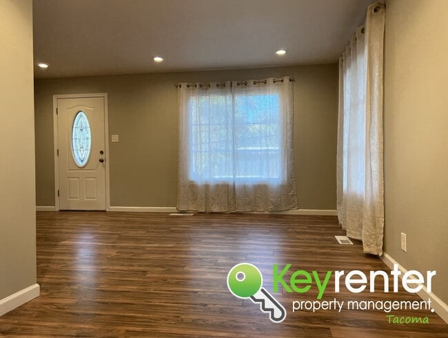 Photo - Modern Fircrest Gem: Sleek Design, Quartz Counters & Natural Oasis!