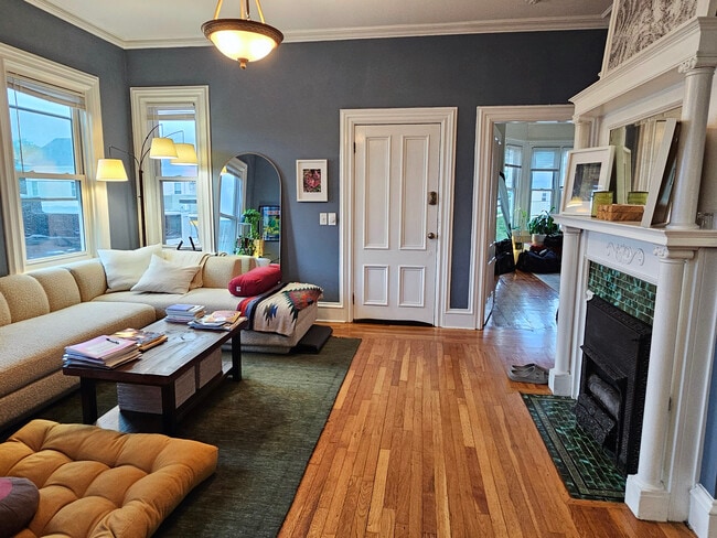 Large & sunny living area with view into master bedroom suite