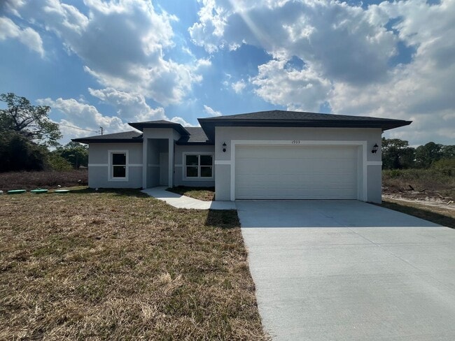 Building Photo - MODERN BRAND NEW 4BD/2BA RETREAT IN LEHIGH ACRES!