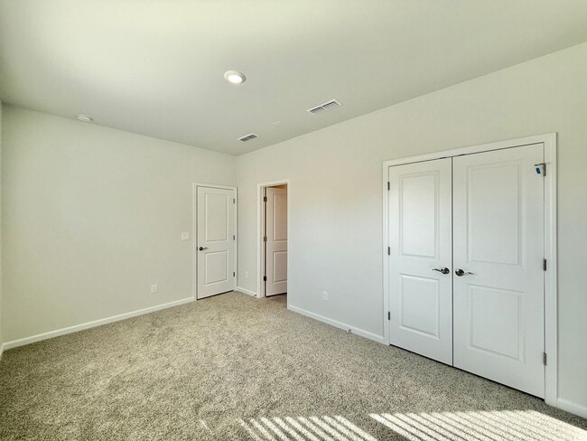 Photo - Stunning New Construction 4BD, 3.5BA Apex Townhome with a 2-Car Garage in a Prime Location Near T...