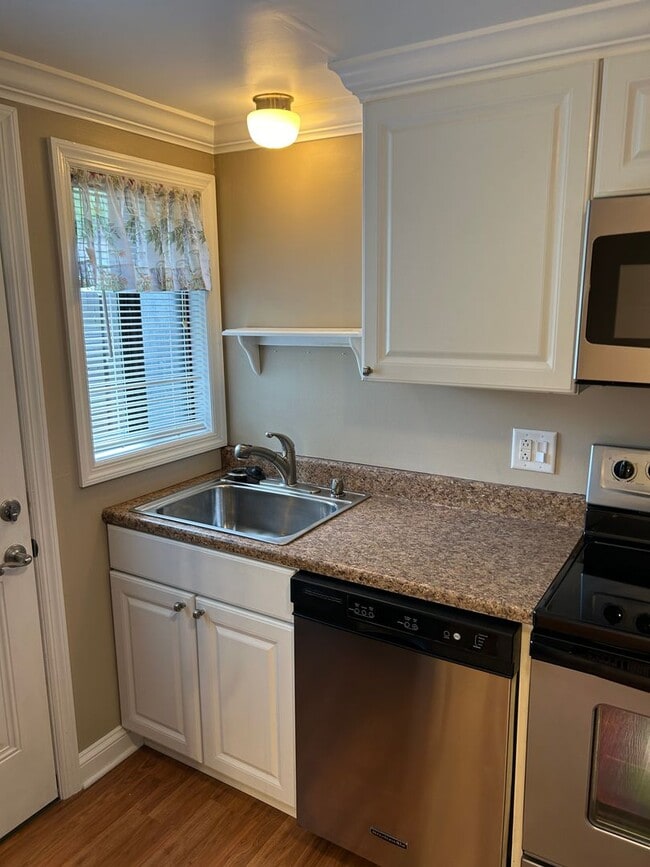 Photo - Modern Charm: 2 BR Home with Finished Basement, Pet Friendly, Assigned Parking, and Prime Location!