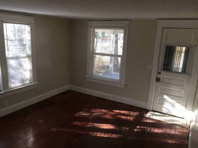 This is the family room looking towards the front porch. - 1542 South Center Street Unit 1542