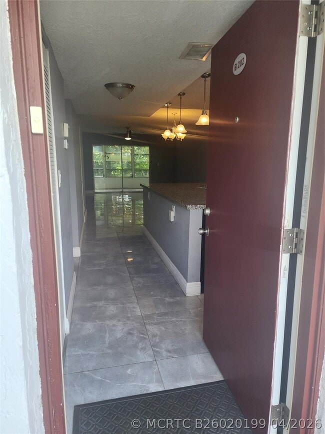 Building Photo - 8205 NW 61st St Unit B202
