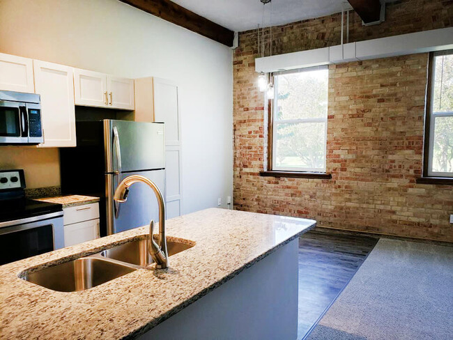 Chic Exposed Brick Walls - Grand Ledge Apartments