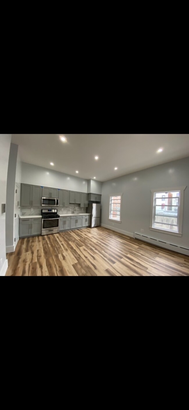 White Quartz countertop, Italian tiles at backsplash. Stainless steel appliances. - 1202 Rogers Ave Unit 1202 Rogers Ave. Apt #3b
