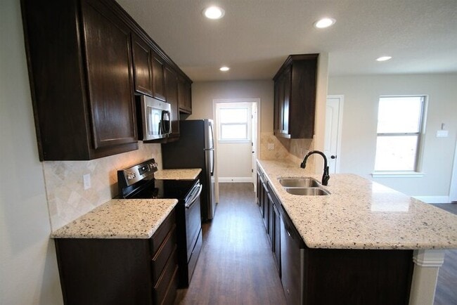 Photo - Gorgeous 3/2 Duplex | Gourmet Kitchen, Plank Floors, 2-Car Parking | Weatherford