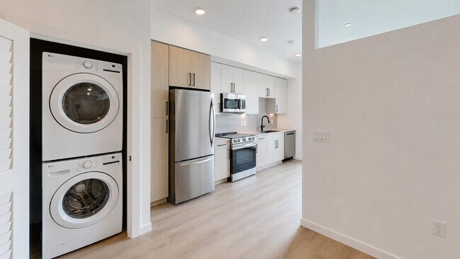 Modern kitchen and laundry nook in daylight