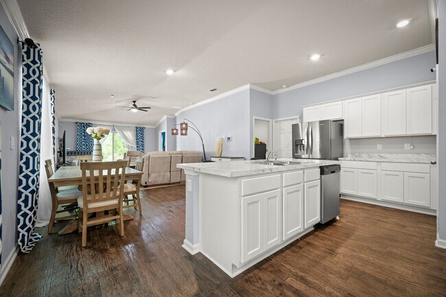 Photo - Spacious 4-Bedroom Home with Fenced Yard & Community Amenities