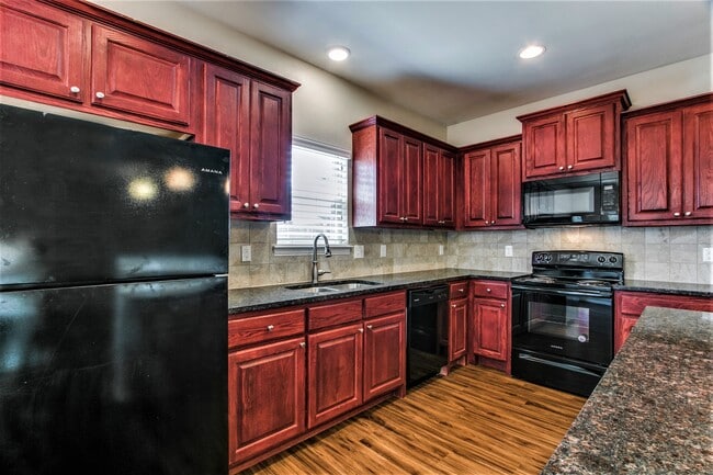 Gourmet Kitchen- Cherrywood raised panel cabinets and granite! - 4917 Sanger Circle Casa Adosada