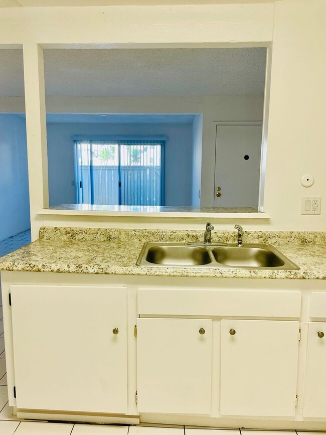 Photo - Charming 2-Bedroom, 1.75-Bathroom Unit with Garage, Patio & Community Amenities! Unit 208