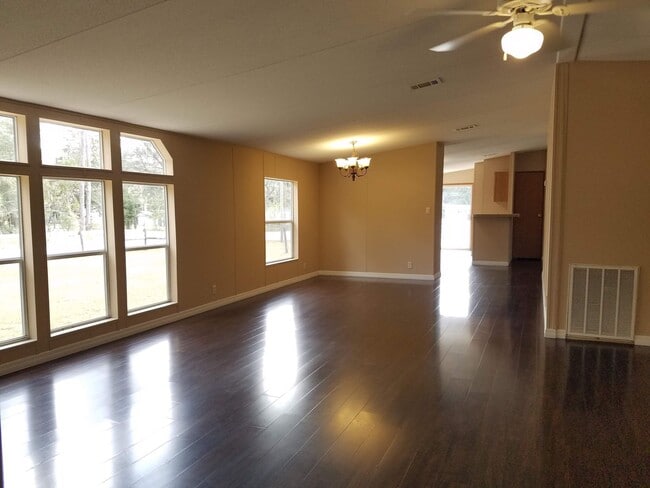 Building Photo - 3 bedroom 2 bath on 1/2 acre of land with a FENCED YARD