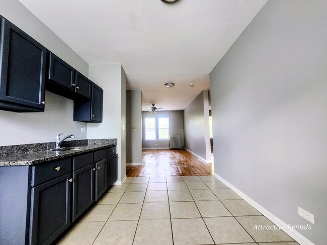 Building Photo - 1465 E 68th St Unit 2