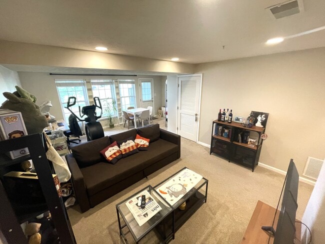 Entry level space. Louvered door is laundry room. - 1466 Pangbourne Way