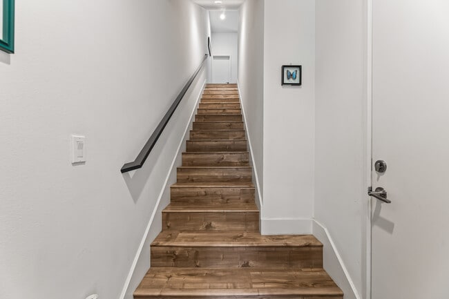 Foyer with access to private attached one car garage with storage and EV charging. - 215 Elm Ave