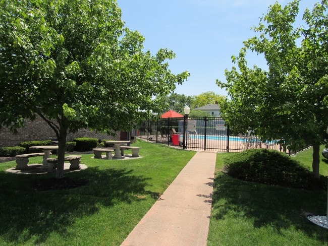 picnic area and entrance to pool - Carriage Hill Condos and Apartments